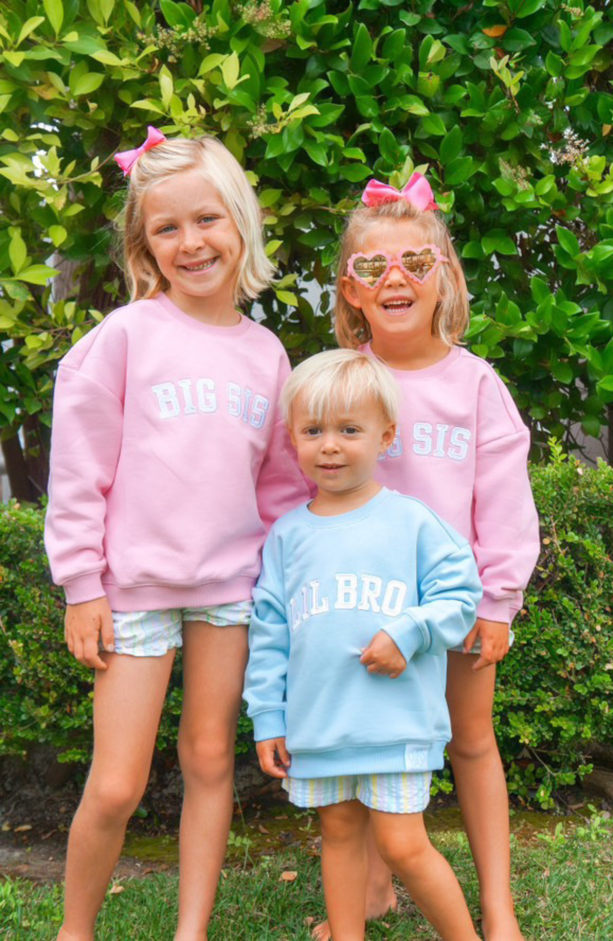 Child wearing big brother hat and big brother t-shirt from Wild Lapin Children's Boutique